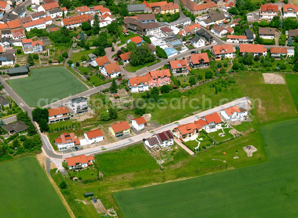 Aerial image Lautersheim - Agricultural land and field boundaries surround the settlement area of the village in Lautersheim in the state Rhineland-Palatinate, Germany