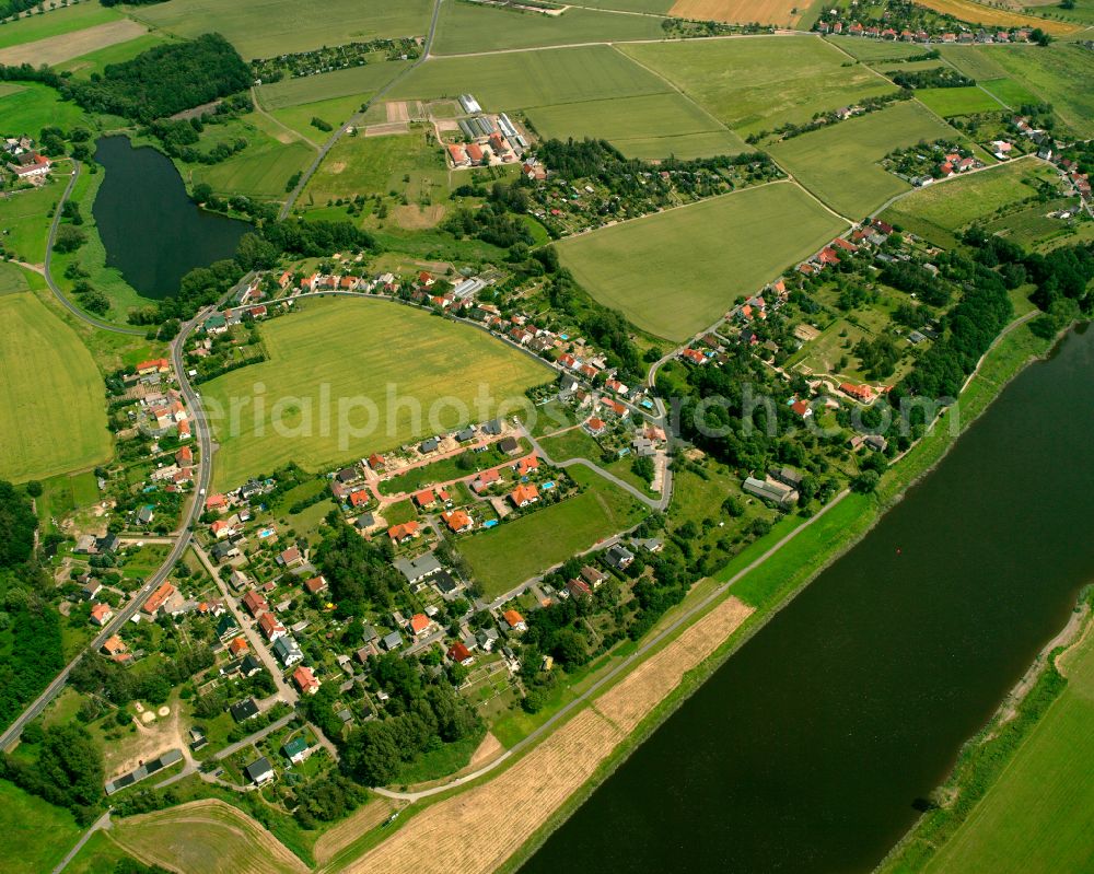 Aerial photograph Leckwitz - Agricultural land and field boundaries surround the settlement area of the village in Leckwitz in the state Saxony, Germany