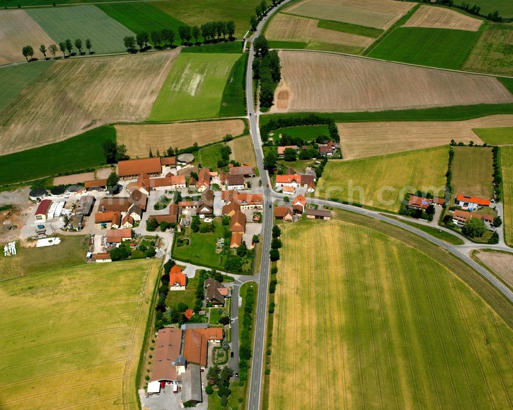 Leibelbach from the bird's eye view: Agricultural land and field boundaries surround the settlement area of the village in Leibelbach in the state Bavaria, Germany