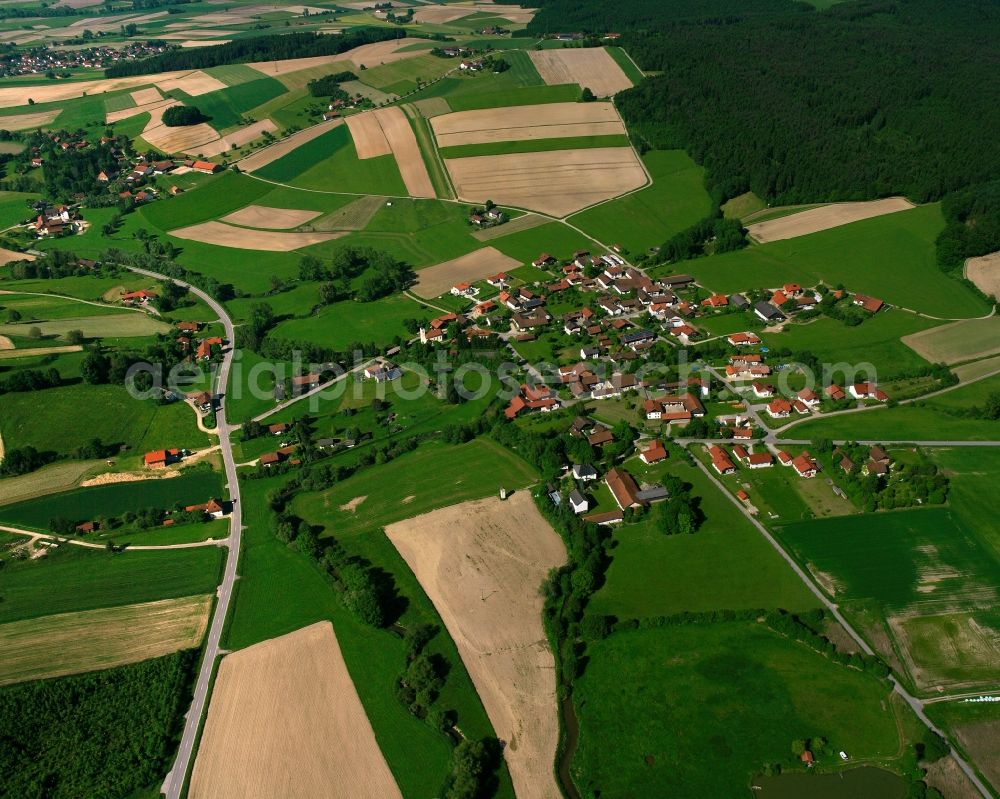 Lengsham from above - Agricultural land and field boundaries surround the settlement area of the village in Lengsham in the state Bavaria, Germany