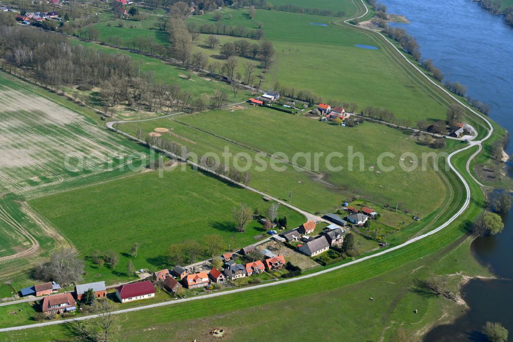 Aerial photograph Lenzerwische - Agricultural land and field boundaries surround the settlement area of the village in Lenzerwische in the state Brandenburg, Germany