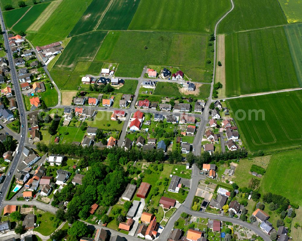 Aerial image Leusel - Agricultural land and field boundaries surround the settlement area of the village in Leusel in the state Hesse, Germany