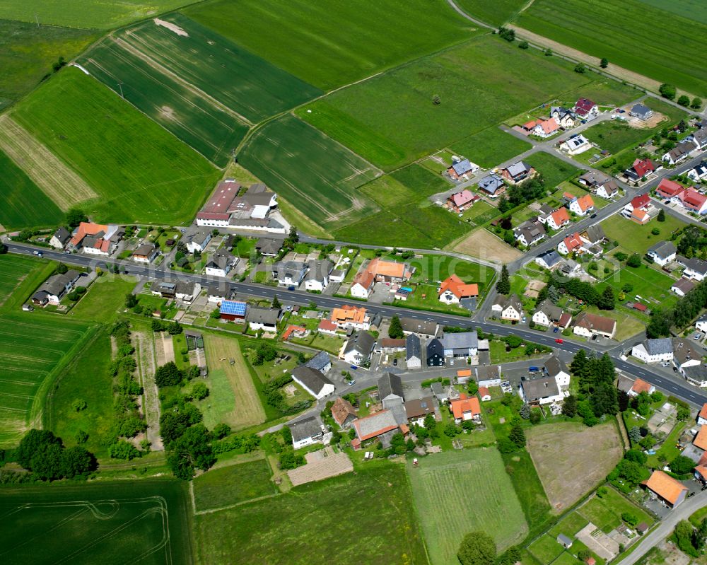 Aerial photograph Leusel - Agricultural land and field boundaries surround the settlement area of the village in Leusel in the state Hesse, Germany