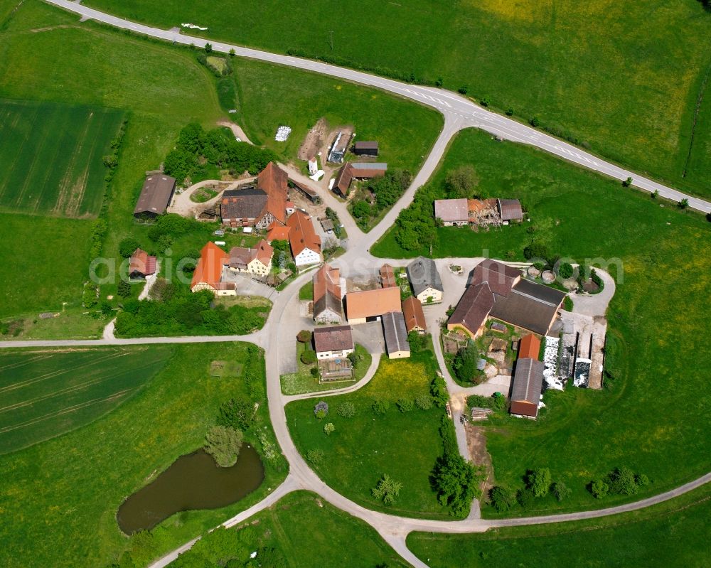 Leutershausen from above - Agricultural land and field boundaries surround the settlement area of the village in Leutershausen in the state Bavaria, Germany