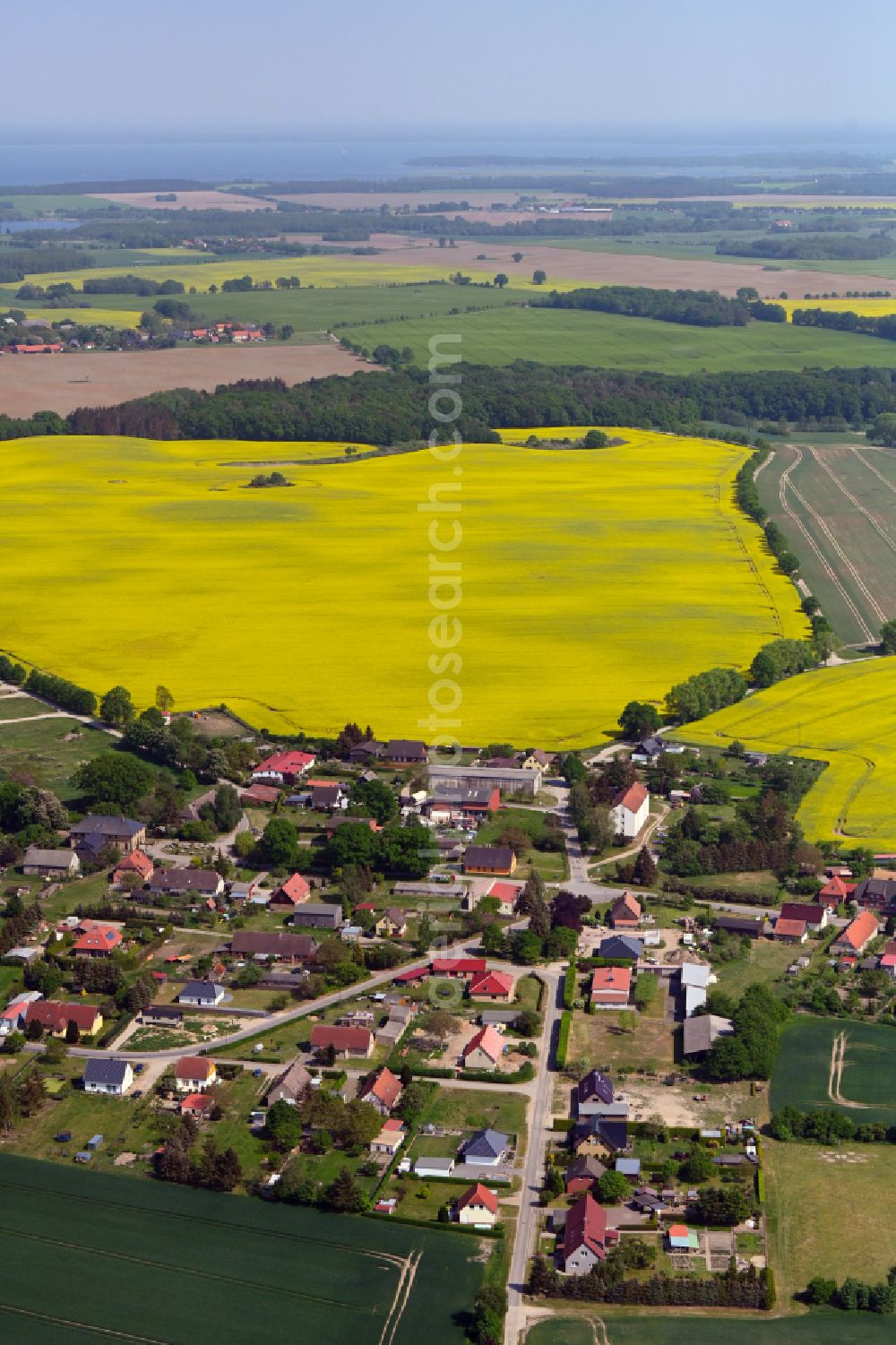 Aerial image Lexow - Agricultural land and field boundaries surround the settlement area of the village in Lexow in the state Mecklenburg - Western Pomerania, Germany