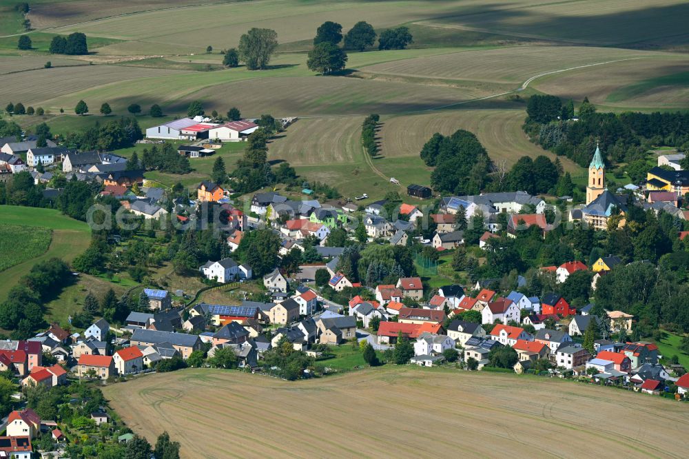 Lichtenberg from the bird's eye view: Agricultural land and field boundaries surround the settlement area of the village in Lichtenberg in the state Saxony, Germany