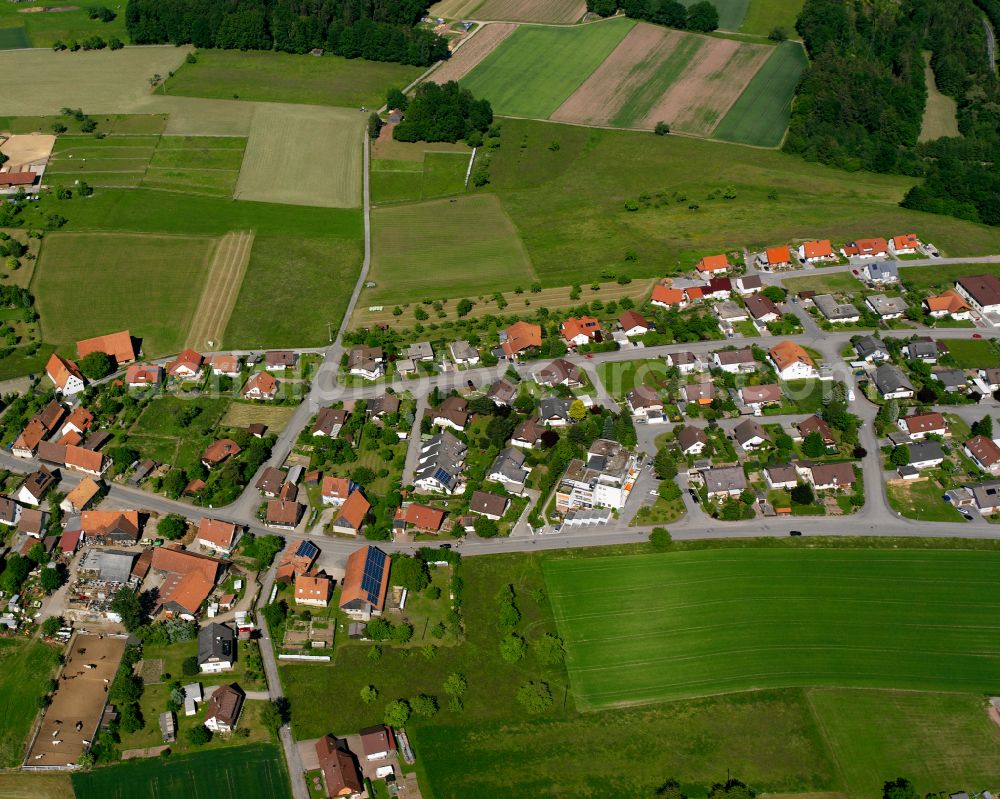 Aerial photograph Liebelsberg - Agricultural land and field boundaries surround the settlement area of the village in Liebelsberg in the state Baden-Wuerttemberg, Germany