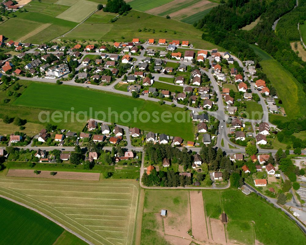 Liebelsberg from the bird's eye view: Agricultural land and field boundaries surround the settlement area of the village in Liebelsberg in the state Baden-Wuerttemberg, Germany