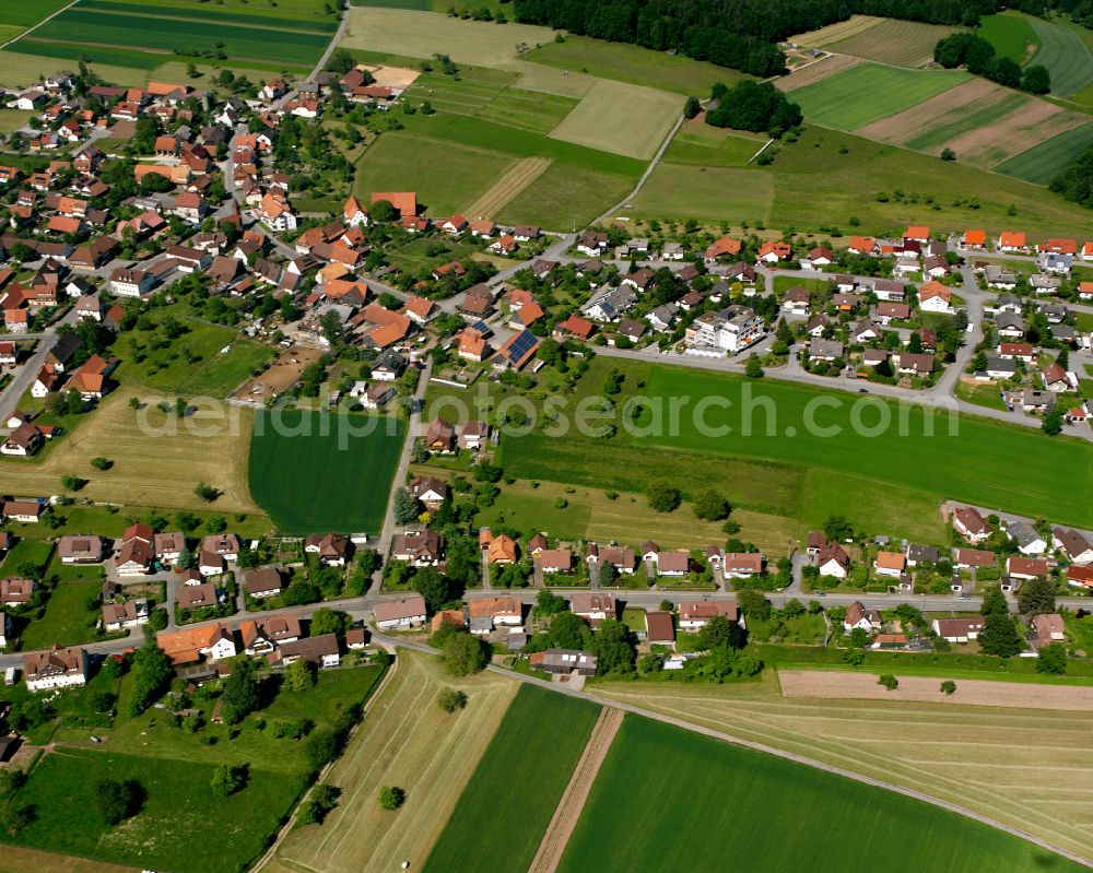 Aerial image Liebelsberg - Agricultural land and field boundaries surround the settlement area of the village in Liebelsberg in the state Baden-Wuerttemberg, Germany