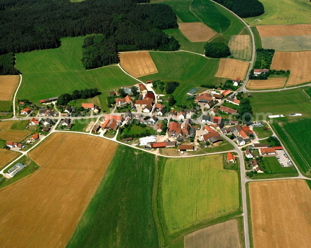 Aerial image Liebersdorf - Agricultural land and field boundaries surround the settlement area of the village in Liebersdorf in the state Bavaria, Germany