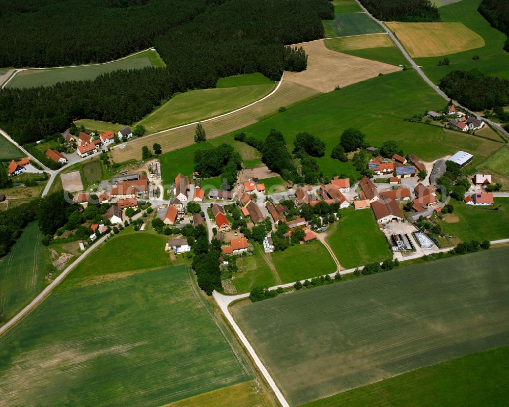 Limbach from the bird's eye view: Agricultural land and field boundaries surround the settlement area of the village in Limbach in the state Bavaria, Germany