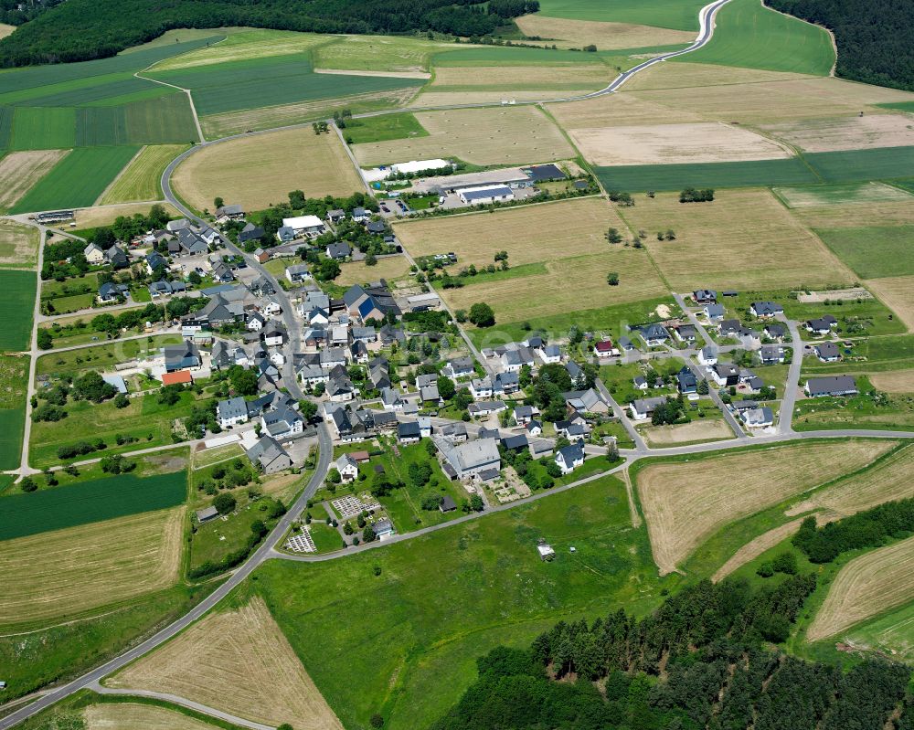 Lindenschied from above - Agricultural land and field boundaries surround the settlement area of the village in Lindenschied in the state Rhineland-Palatinate, Germany