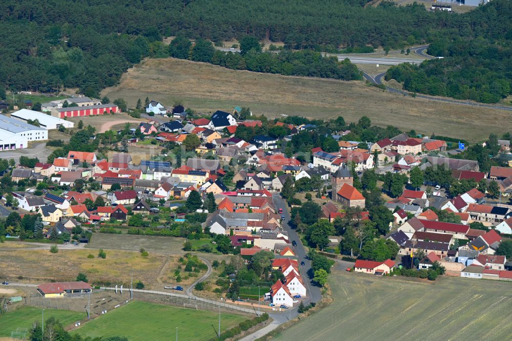 Linthe from above - Agricultural land and field boundaries surround the settlement area of the village in Linthe in the state Brandenburg, Germany