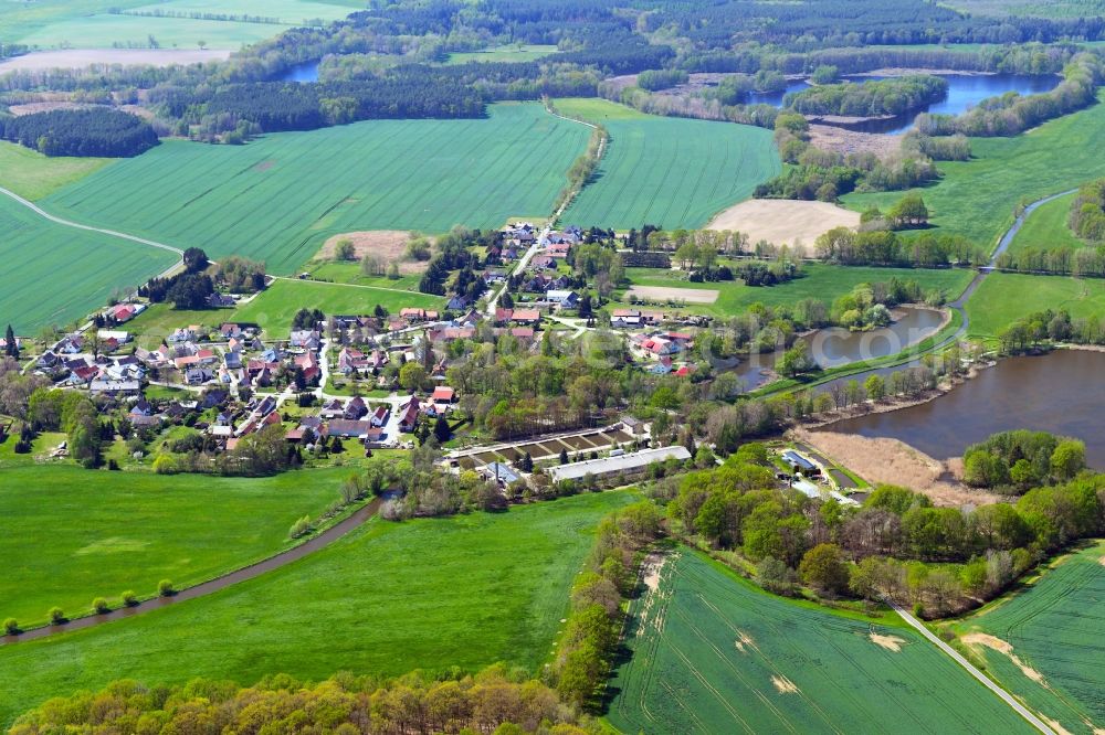 Lippitsch from above - Agricultural land and field boundaries surround the settlement area of the village in Lippitsch in the state Saxony, Germany