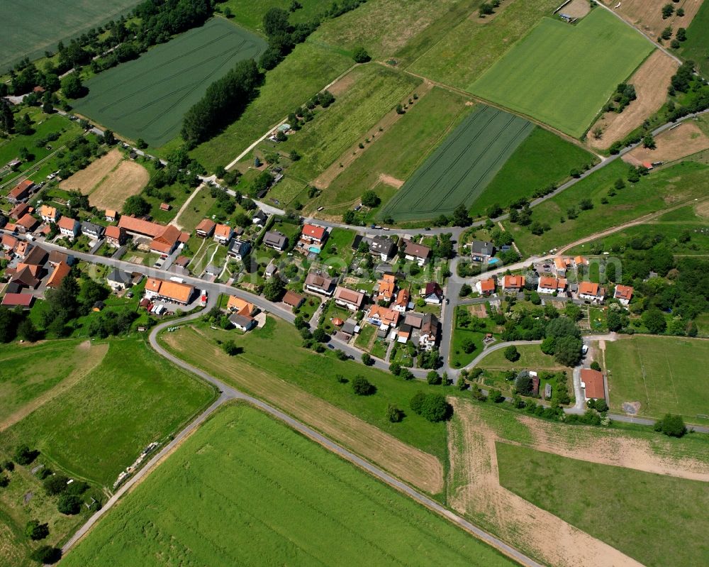 Aerial image Lippoldshausen - Agricultural land and field boundaries surround the settlement area of the village in Lippoldshausen in the state Lower Saxony, Germany