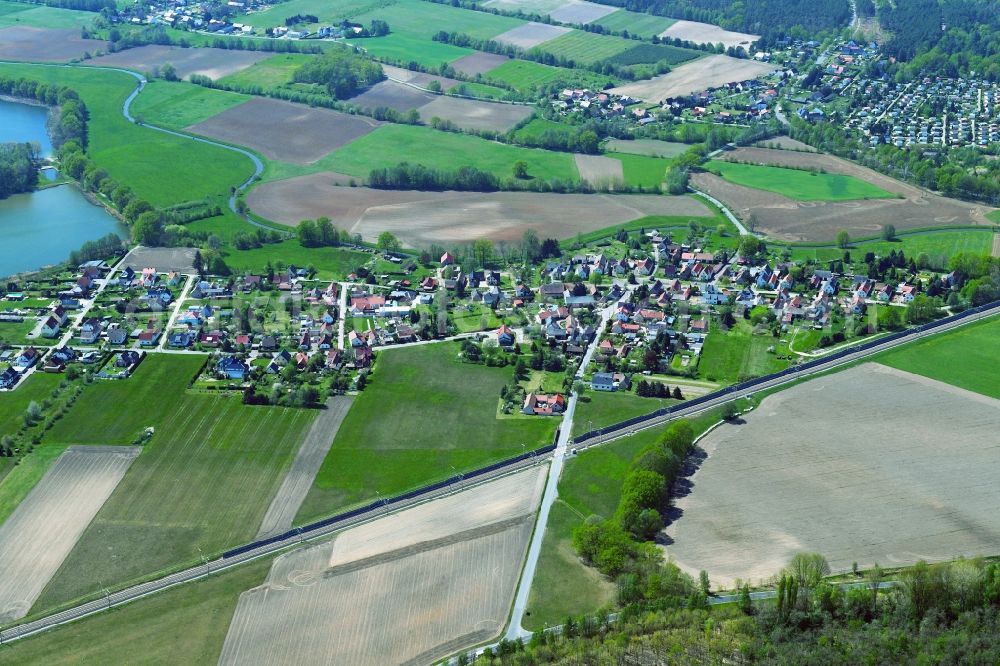 Aerial image Litschen - Agricultural land and field boundaries surround the settlement area of the village in Litschen in the state Saxony, Germany