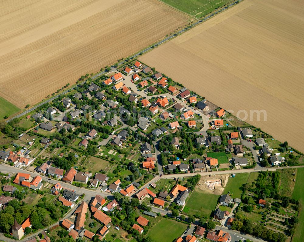 Lochtum from the bird's eye view: Agricultural land and field boundaries surround the settlement area of the village in Lochtum in the state Lower Saxony, Germany