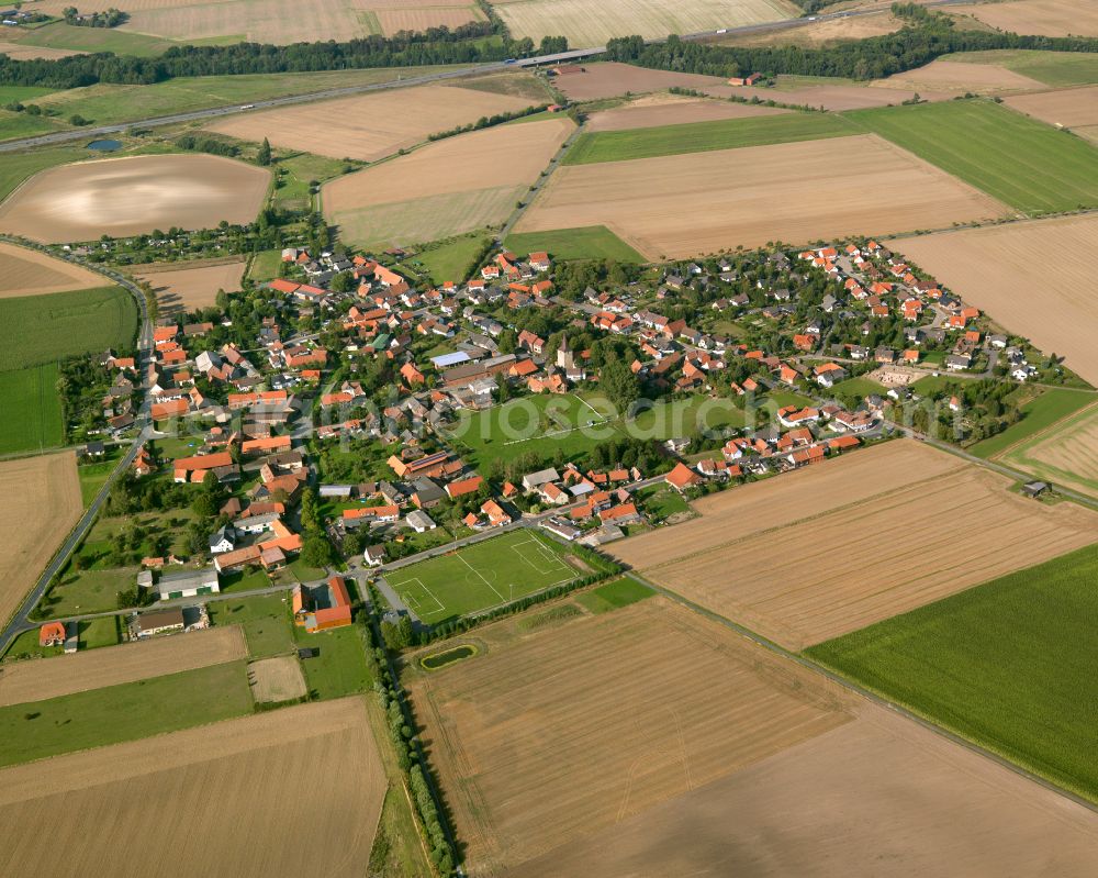 Aerial image Lochtum - Agricultural land and field boundaries surround the settlement area of the village in Lochtum in the state Lower Saxony, Germany