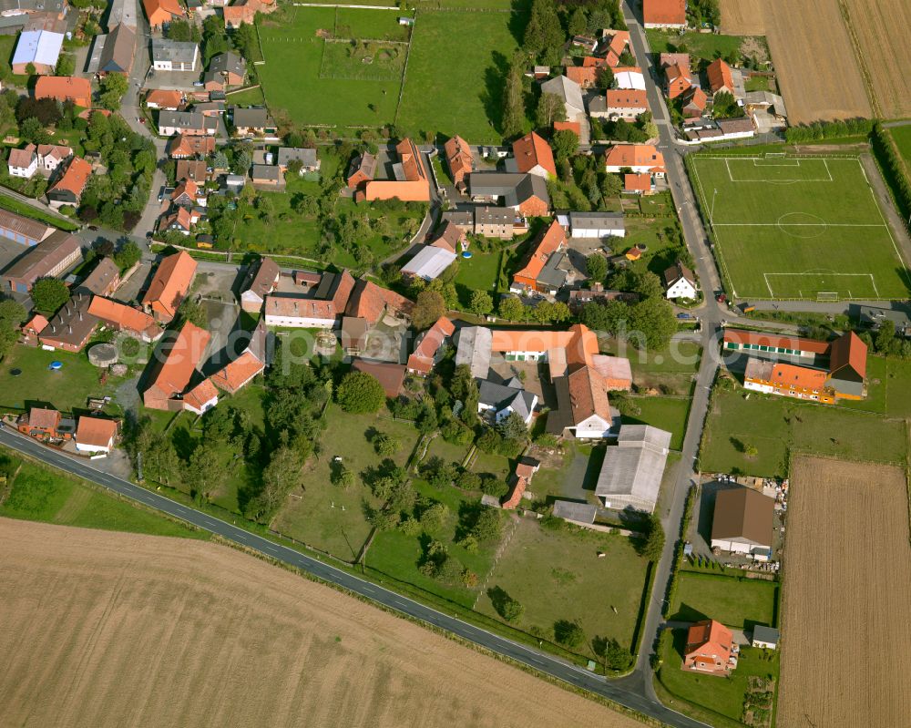 Aerial image Lochtum - Agricultural land and field boundaries surround the settlement area of the village in Lochtum in the state Lower Saxony, Germany