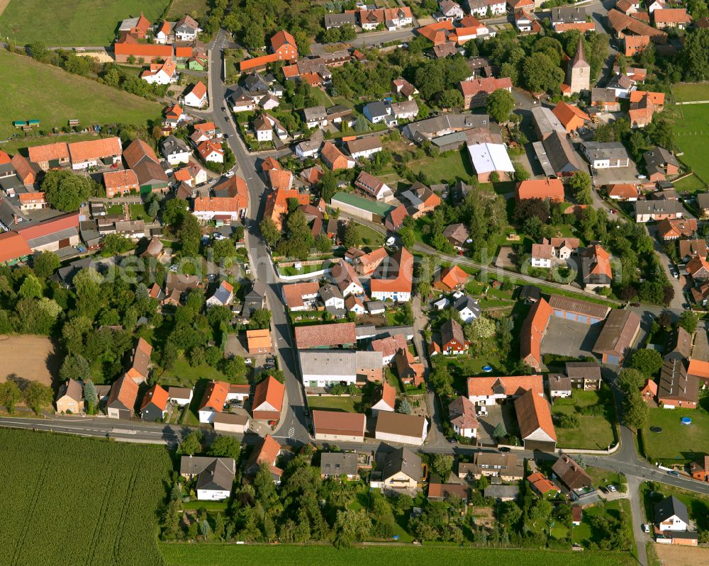 Aerial photograph Lochtum - Agricultural land and field boundaries surround the settlement area of the village in Lochtum in the state Lower Saxony, Germany