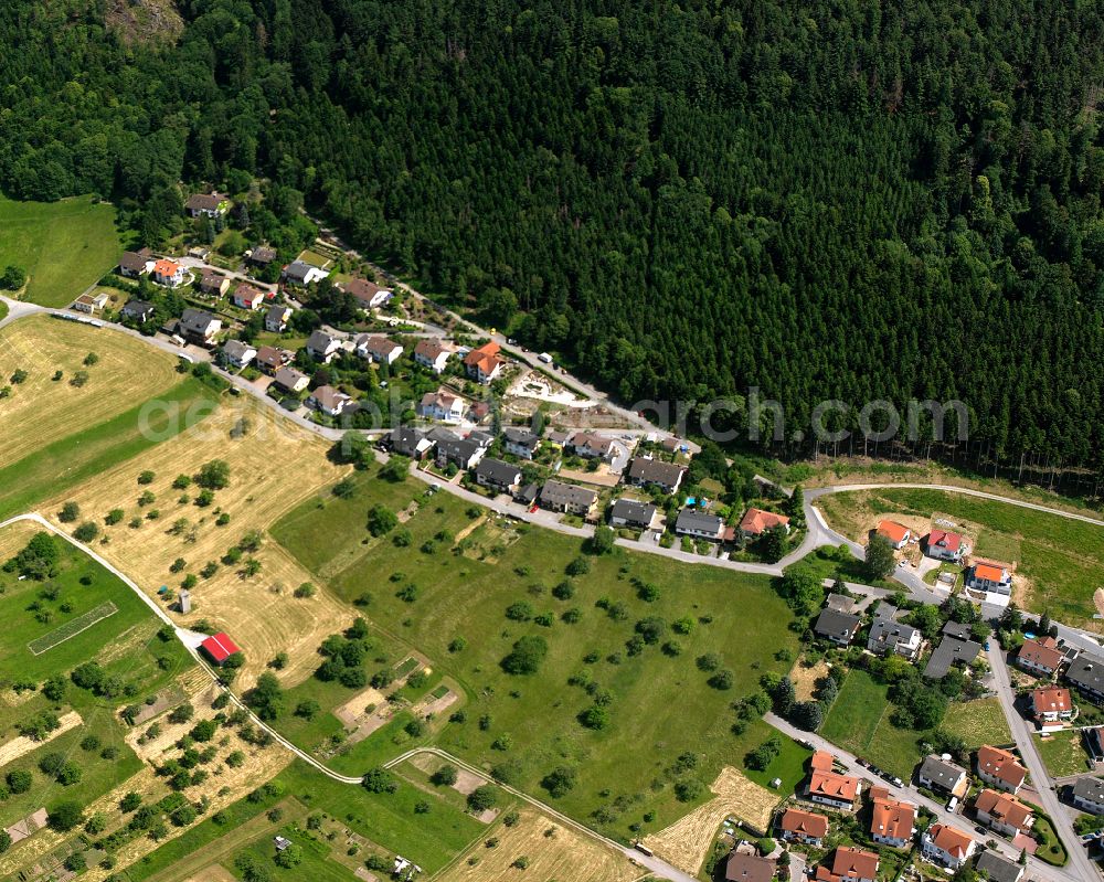 Loffenau from the bird's eye view: Agricultural land and field boundaries surround the settlement area of the village in Loffenau in the state Baden-Wuerttemberg, Germany