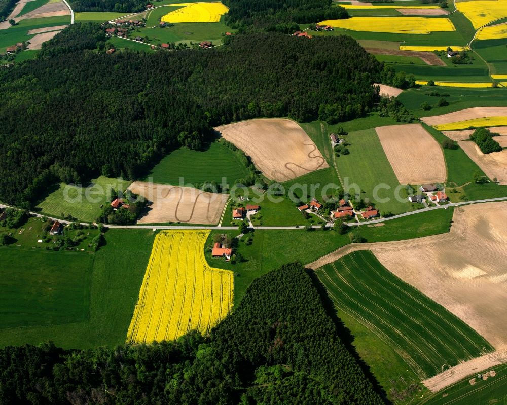 Lohe from the bird's eye view: Agricultural land and field boundaries surround the settlement area of the village in Lohe in the state Bavaria, Germany