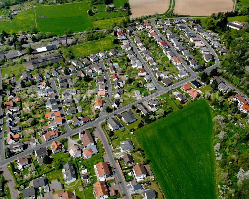 Aerial image Londorf - Agricultural land and field boundaries surround the settlement area of the village in Londorf in the state Hesse, Germany