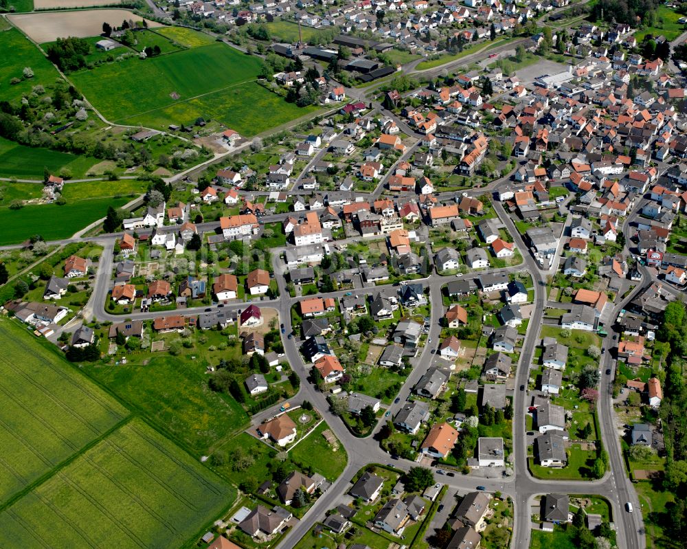 Aerial photograph Londorf - Agricultural land and field boundaries surround the settlement area of the village in Londorf in the state Hesse, Germany