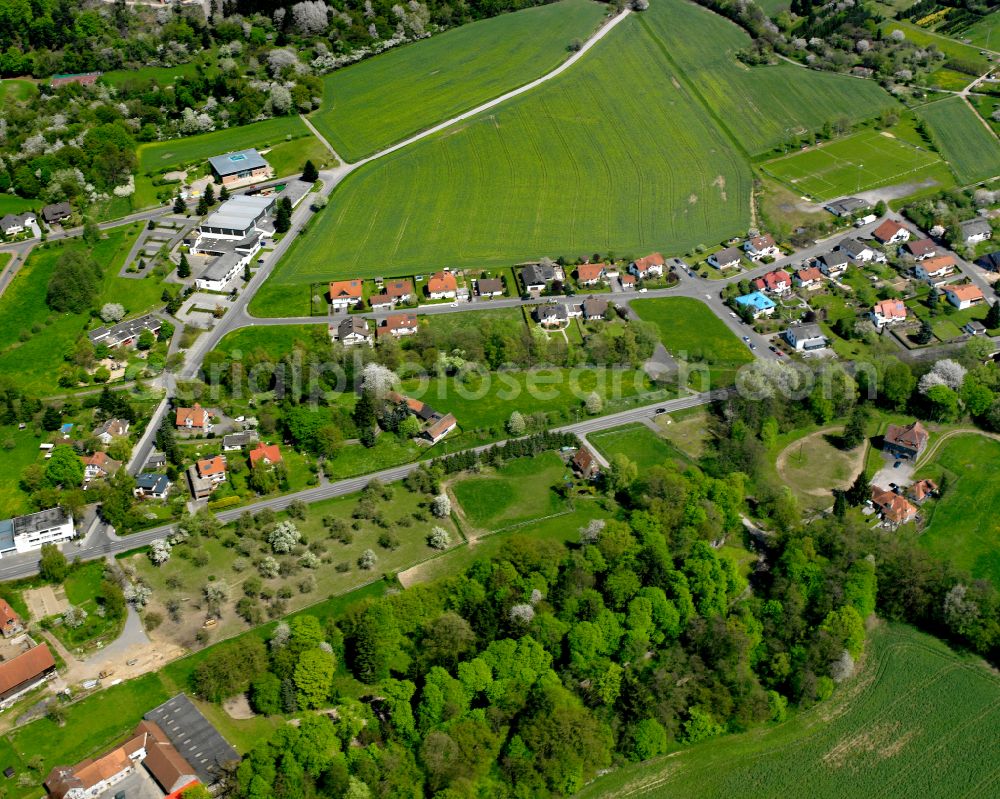 Londorf from above - Agricultural land and field boundaries surround the settlement area of the village in Londorf in the state Hesse, Germany