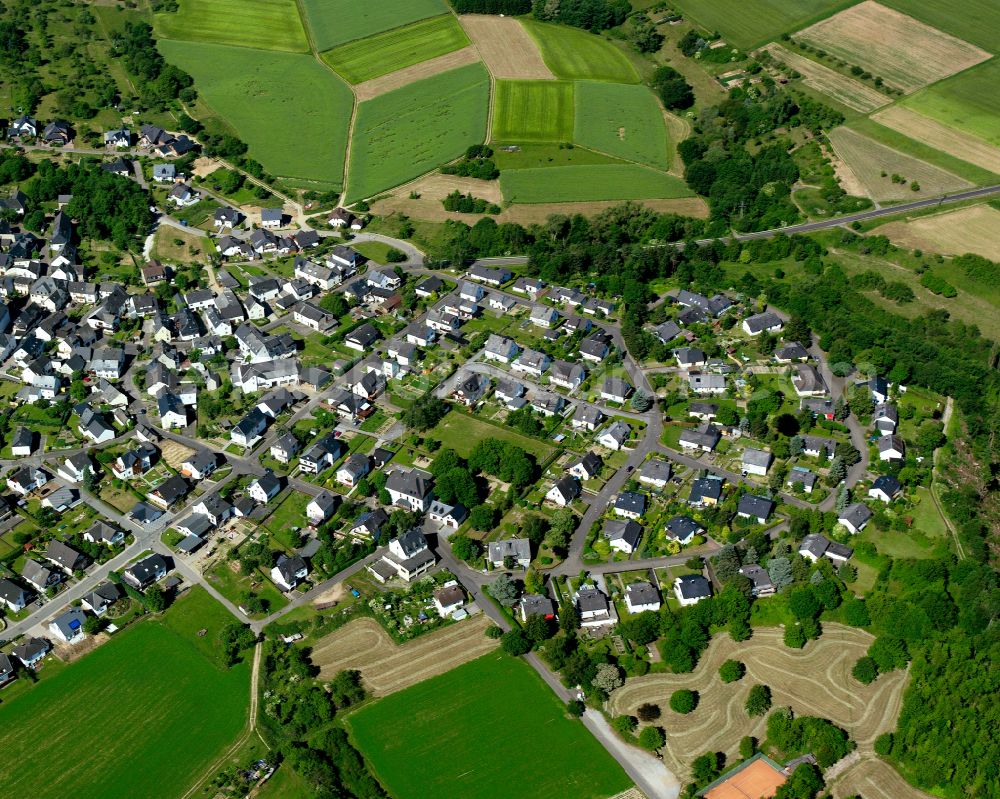 An der Loreley from the bird's eye view: Agricultural land and field boundaries surround the settlement area of the village in An der Loreley in the state Rhineland-Palatinate, Germany