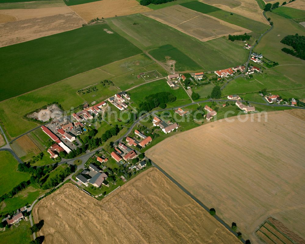 Lötzschen from above - Agricultural land and field boundaries surround the settlement area of the village in Lötzschen in the state Saxony, Germany