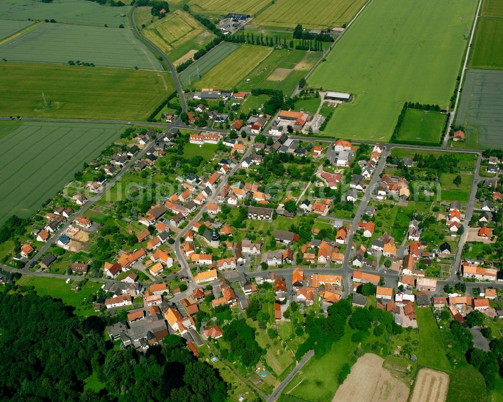 Lutterberg from above - Agricultural land and field boundaries surround the settlement area of the village in Lutterberg in the state Lower Saxony, Germany