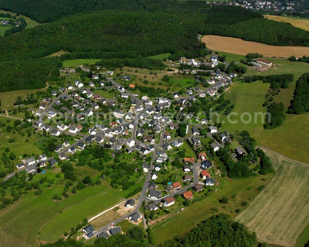 Mackenrodt from the bird's eye view: Agricultural land and field boundaries surround the settlement area of the village in Mackenrodt in the state Rhineland-Palatinate, Germany