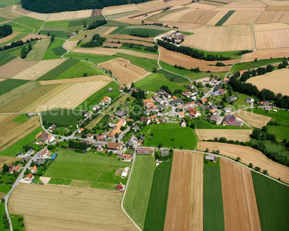 Magenbuch from the bird's eye view: Agricultural land and field boundaries surround the settlement area of the village in Magenbuch in the state Baden-Wuerttemberg, Germany