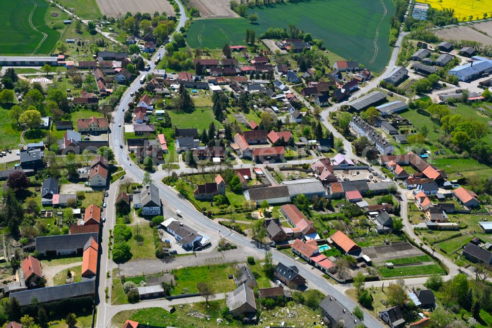 Mahlsdorf from the bird's eye view: Agricultural land and field boundaries surround the settlement area of the village in Mahlsdorf in the state Saxony-Anhalt, Germany