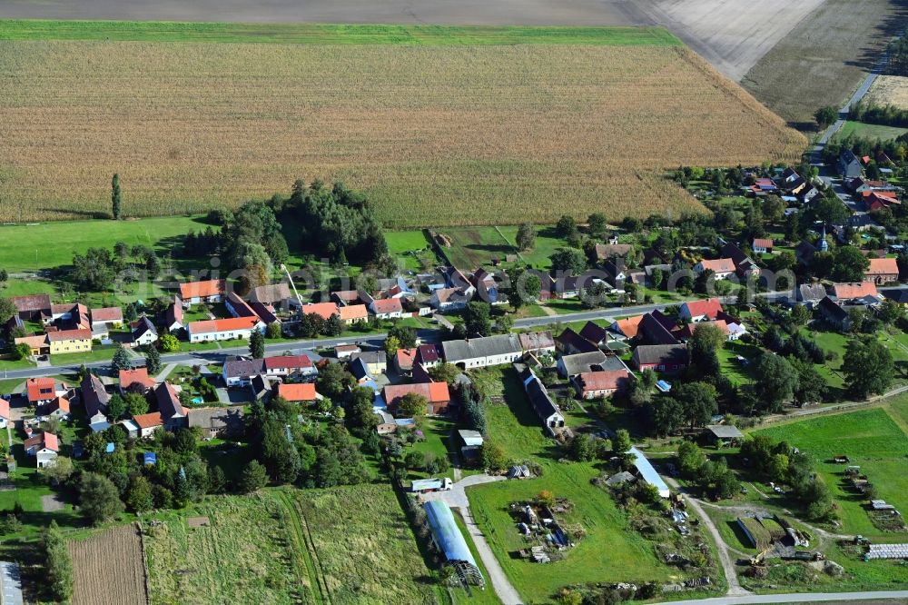 Malitschkendorf from above - Agricultural land and field boundaries surround the settlement area of the village in Malitschkendorf in the state Brandenburg, Germany