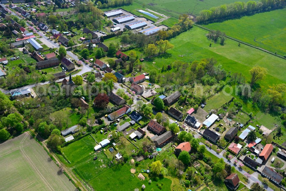 Manker from the bird's eye view: Agricultural land and field boundaries surround the settlement area of the village in Manker in the state Brandenburg, Germany