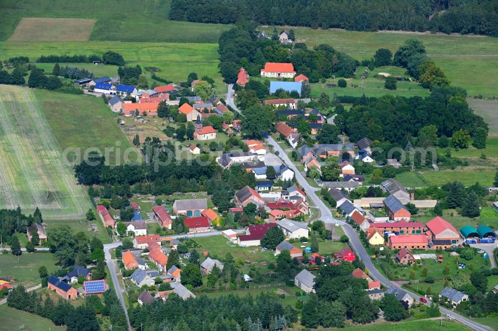 Mankmuß from the bird's eye view: Agricultural land and field boundaries surround the settlement area of the village in Mankmuss in the state Brandenburg, Germany