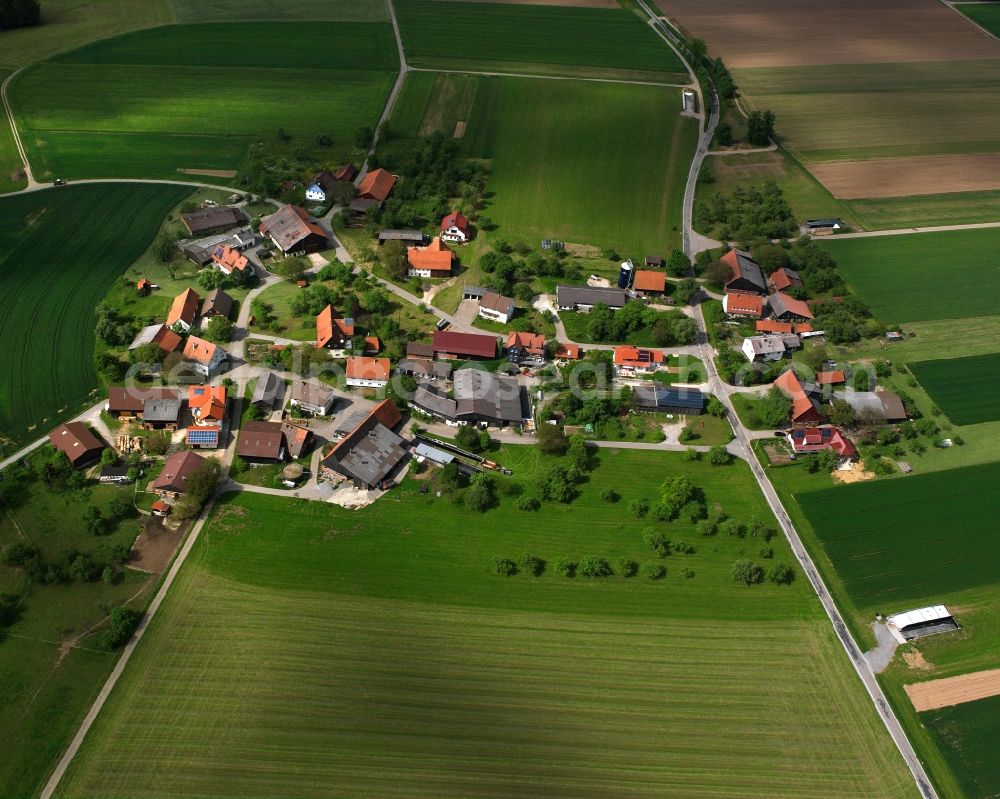 Mannholz from the bird's eye view: Agricultural land and field boundaries surround the settlement area of the village in Mannholz in the state Baden-Wuerttemberg, Germany