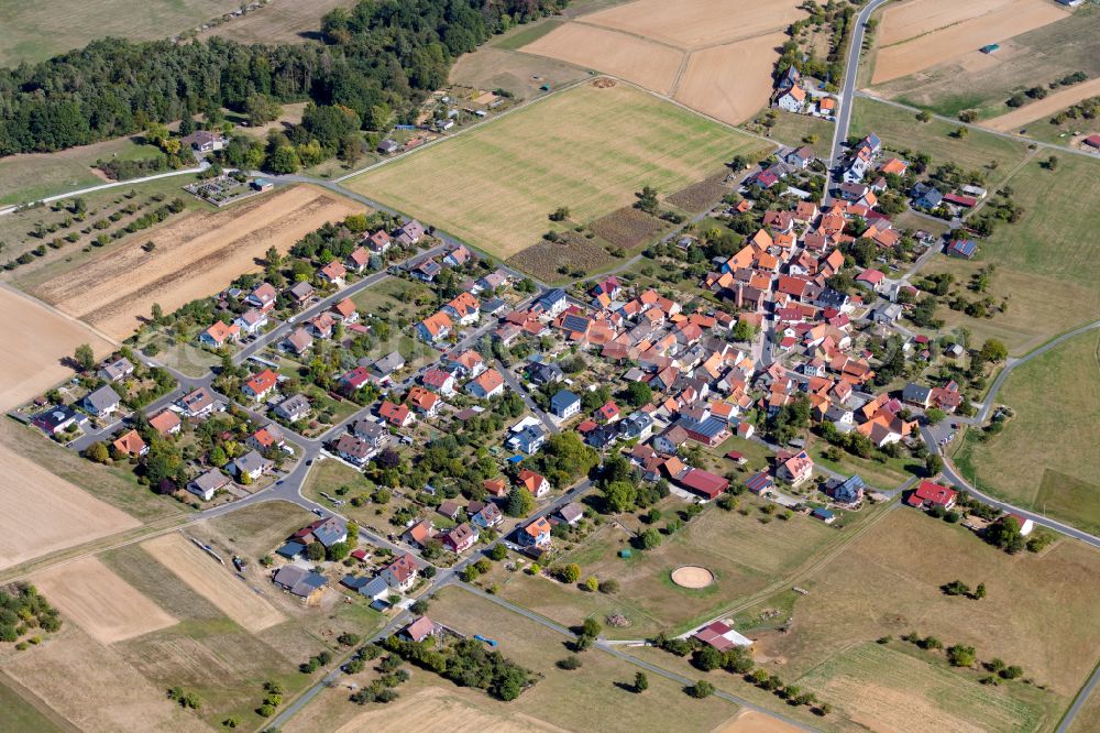 Marienbrunn from above - Agricultural land and field boundaries surround the settlement area of the village in Marienbrunn in the state Bavaria, Germany