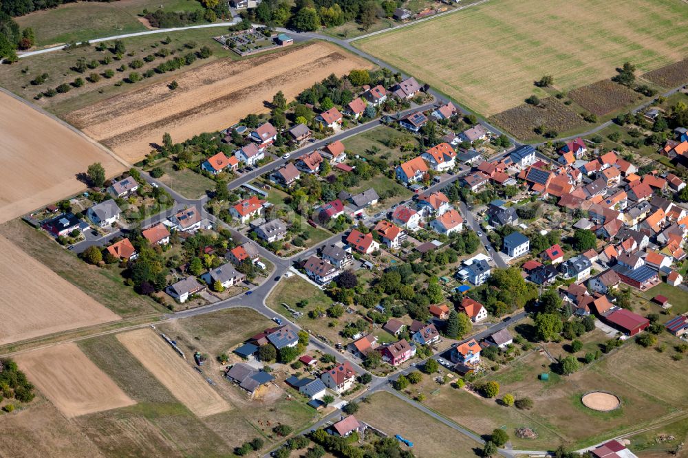 Marienbrunn from the bird's eye view: Agricultural land and field boundaries surround the settlement area of the village in Marienbrunn in the state Bavaria, Germany