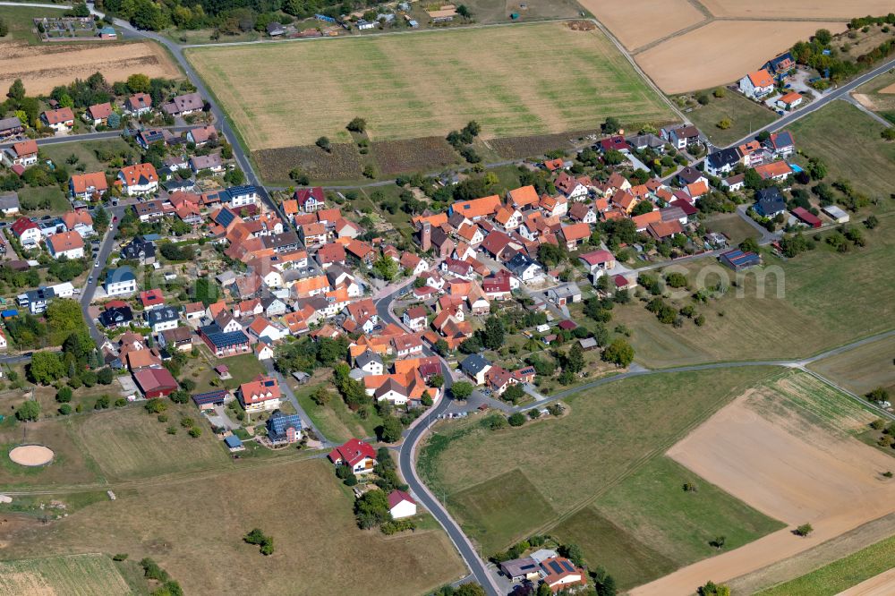 Marienbrunn from above - Agricultural land and field boundaries surround the settlement area of the village in Marienbrunn in the state Bavaria, Germany