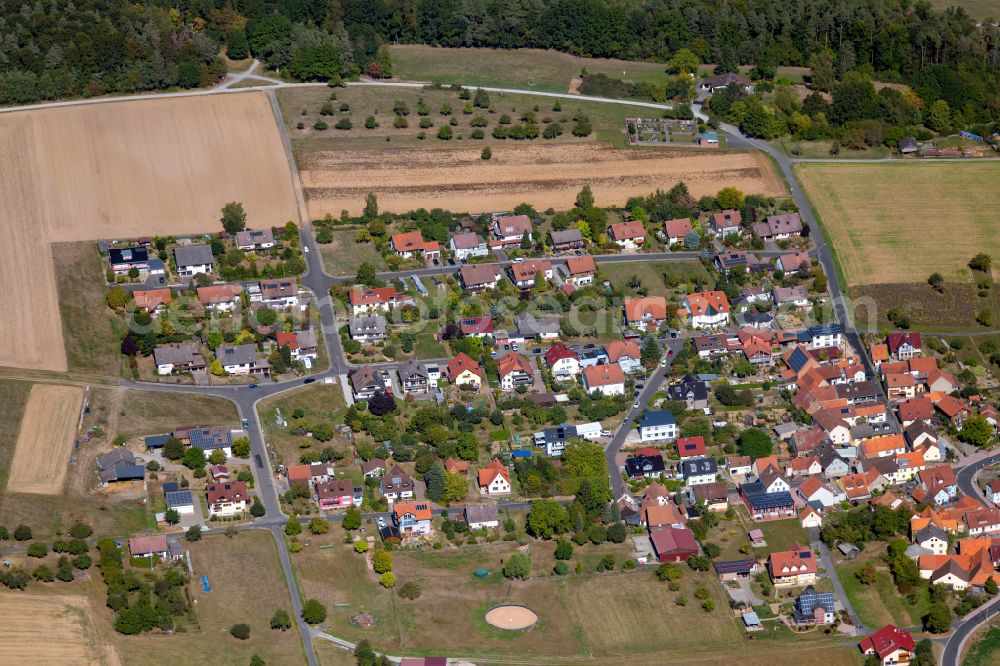 Marienbrunn from above - Agricultural land and field boundaries surround the settlement area of the village in Marienbrunn in the state Bavaria, Germany