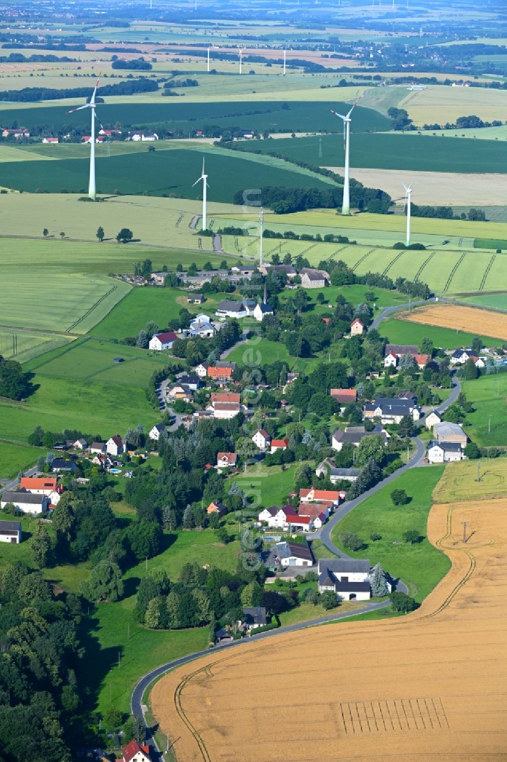 Aerial image Markersdorf - Agricultural land and field boundaries surround the settlement area of the village in Markersdorf in the state Saxony, Germany