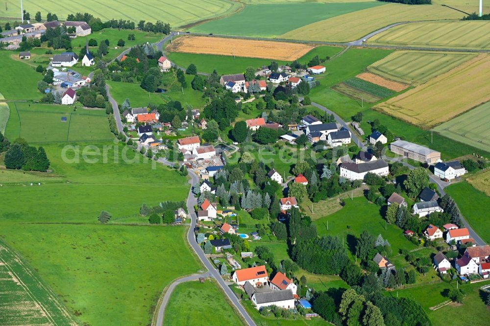 Markersdorf from the bird's eye view: Agricultural land and field boundaries surround the settlement area of the village in Markersdorf in the state Saxony, Germany