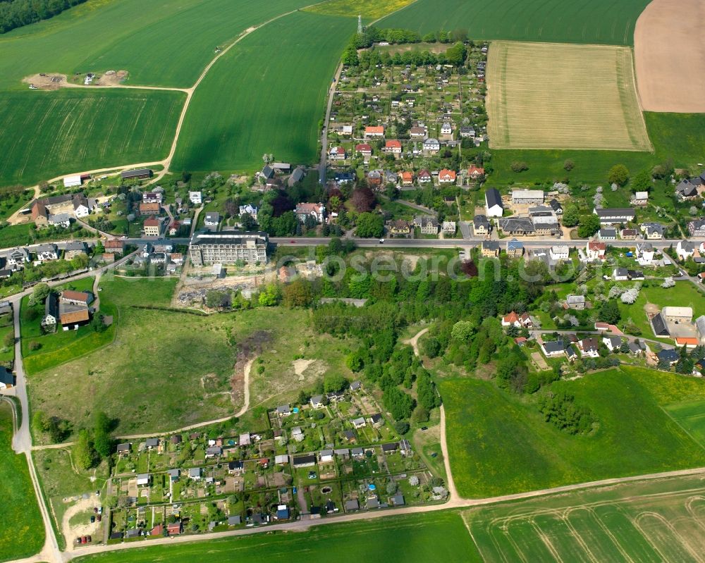 Markersdorf from above - Agricultural land and field boundaries surround the settlement area of the village in Markersdorf in the state Saxony, Germany