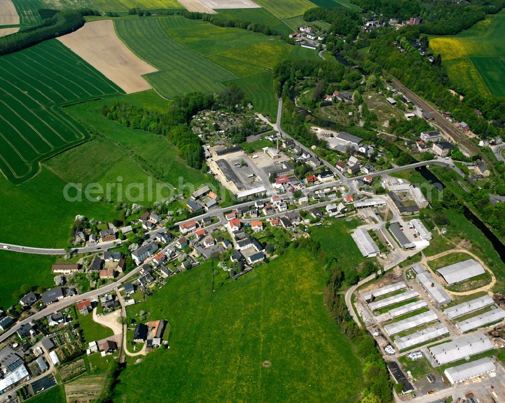 Aerial image Markersdorf - Agricultural land and field boundaries surround the settlement area of the village in Markersdorf in the state Saxony, Germany