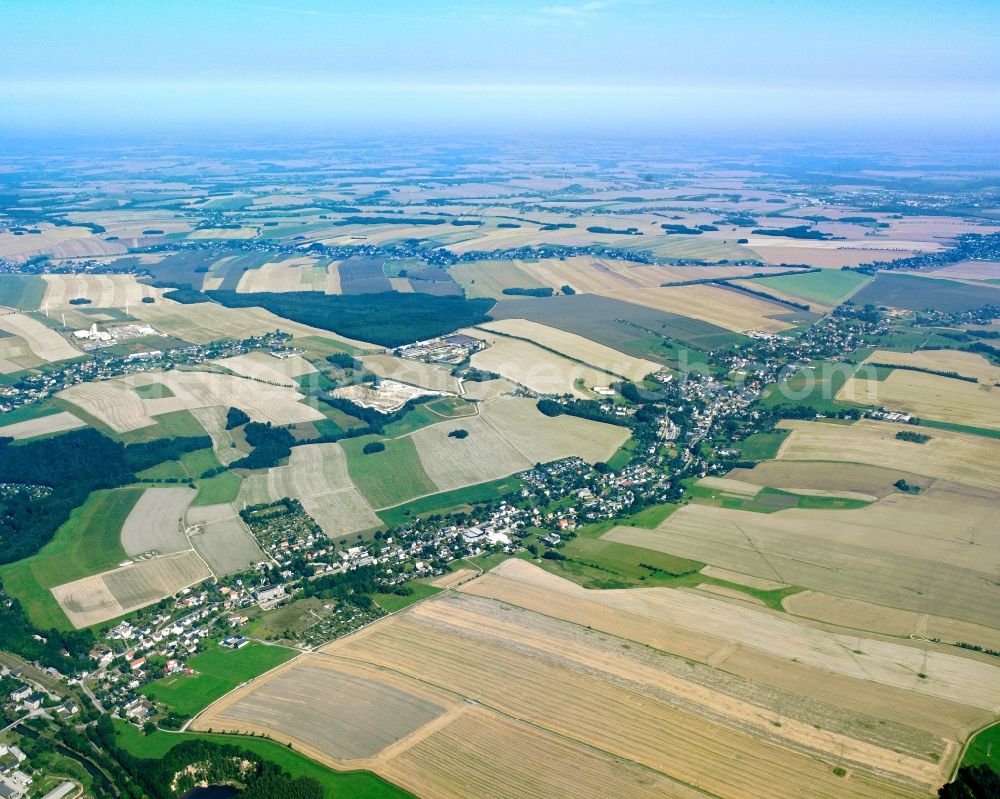 Markersdorf from above - Agricultural land and field boundaries surround the settlement area of the village in Markersdorf in the state Saxony, Germany