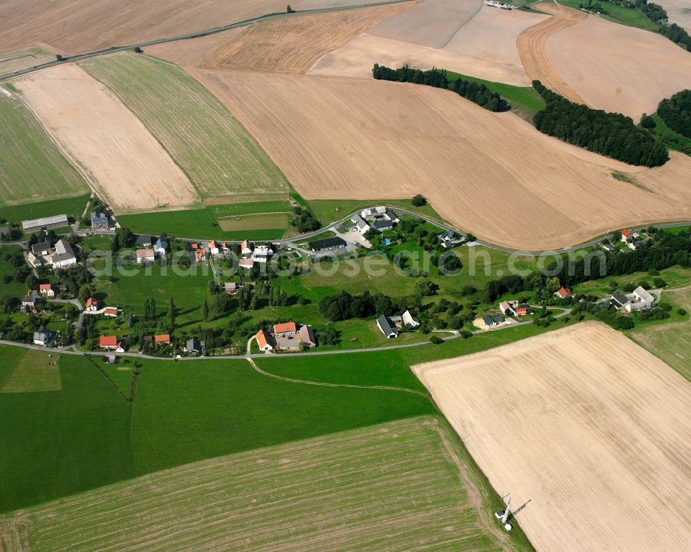 Markersdorf from above - Agricultural land and field boundaries surround the settlement area of the village in Markersdorf in the state Saxony, Germany