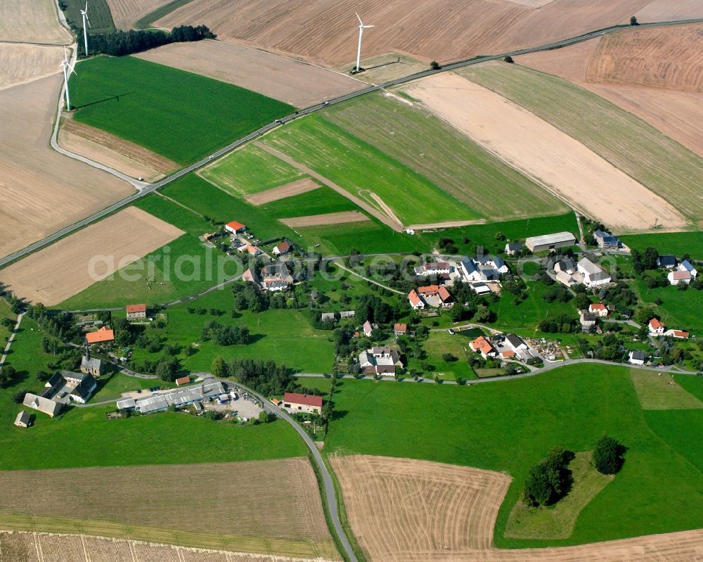 Markersdorf from the bird's eye view: Agricultural land and field boundaries surround the settlement area of the village in Markersdorf in the state Saxony, Germany